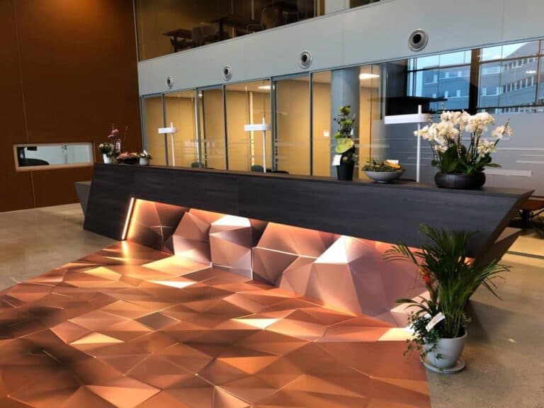 Interior film with wood texture on reception desk and wall elements in Rogaland