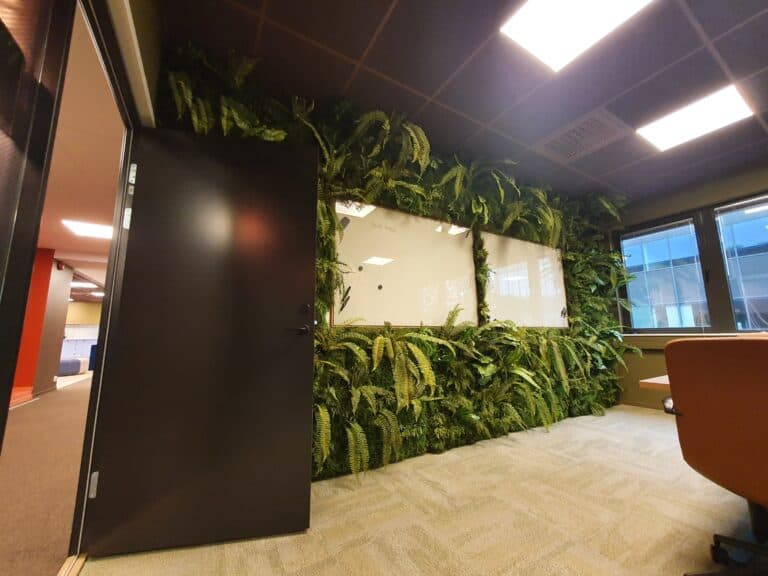 Frosted film with geometric pattern and company logo on entrance area Sandnes