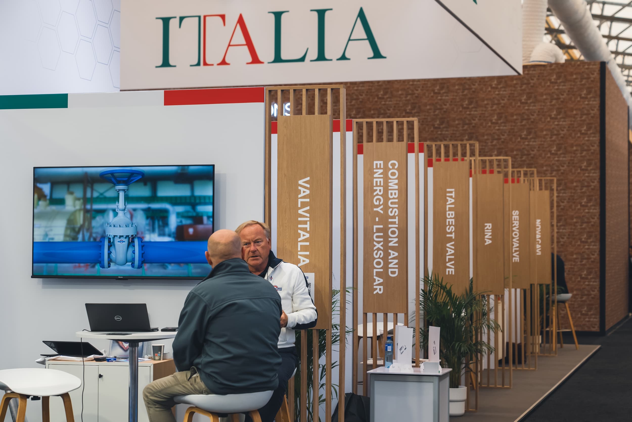 Italian Pavilion at ONS 2024 with shared area and exhibitor booths (5)