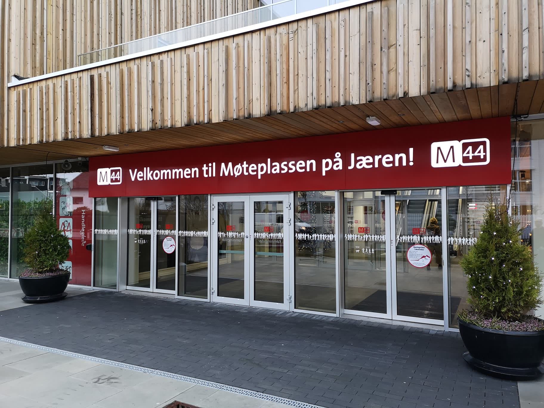 M44 entrance with an illuminated welcome sign above the doors